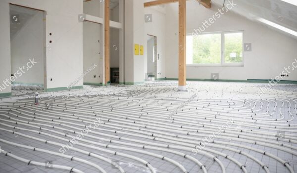 stock-photo-shot-of-construction-site-in-a-loft-where-underfloor-heating-has-just-been-installed-white-pipes-2158786413